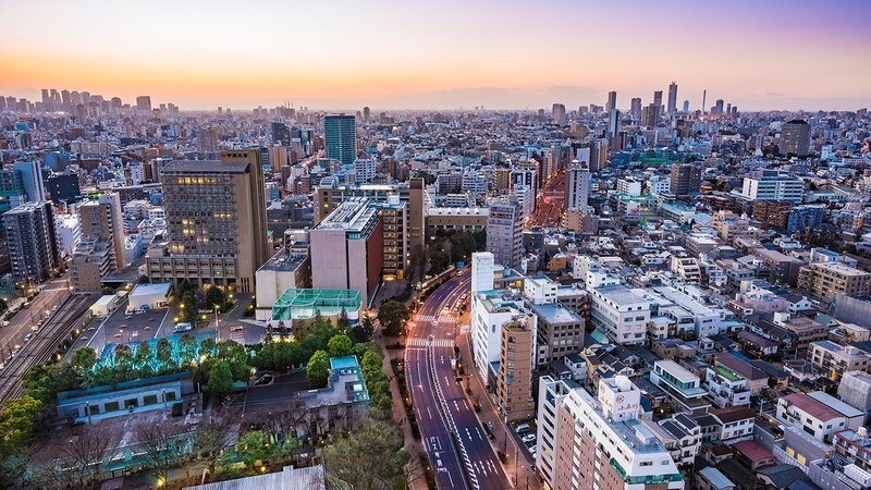 Aerial Cityscape at Dusk — Orange, Serene