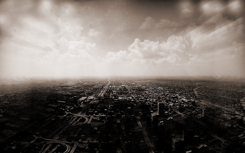 Aerial cityscape under cloudy sky