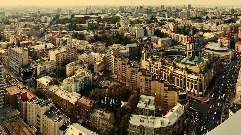 Aerial Cityscape View — Brown, Dramatic, Afternoon, Photograph, Buildings, Cars