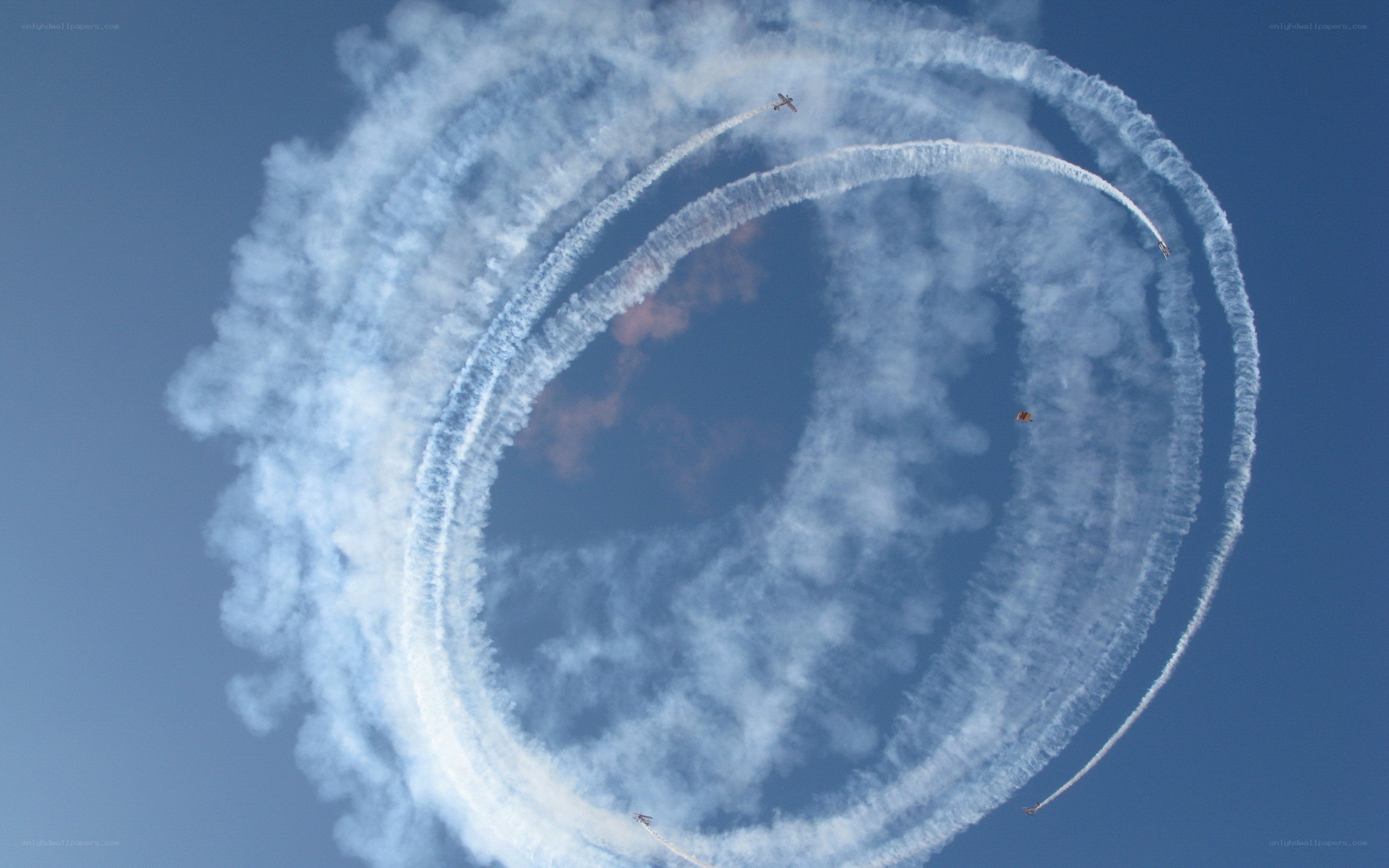 Aerial display with smoke trails