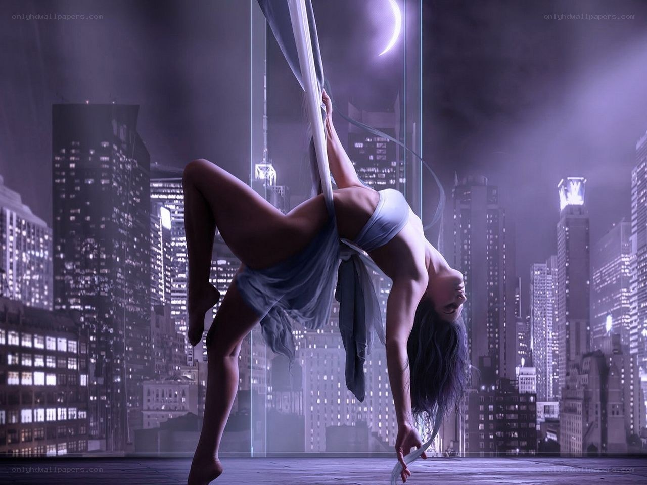 Aerial silk dancer at night