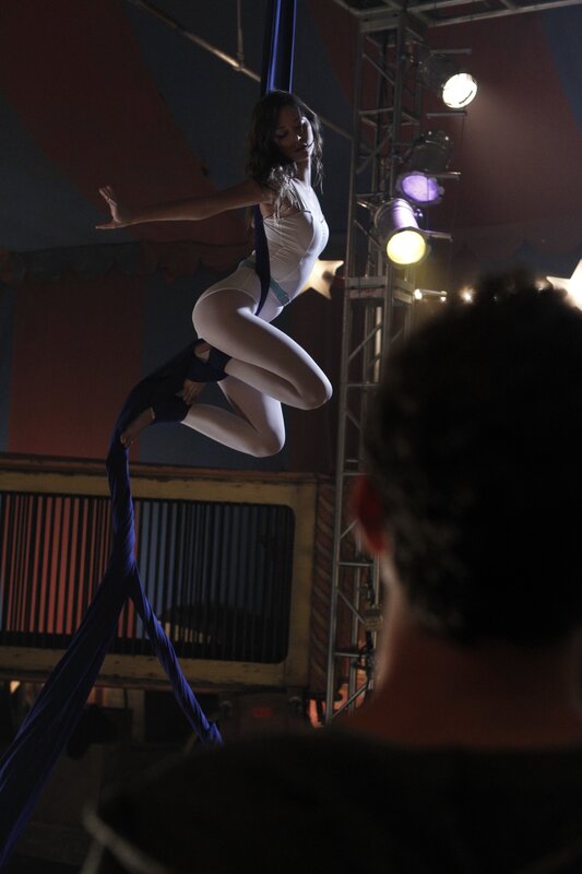 Aerial silk performer in action