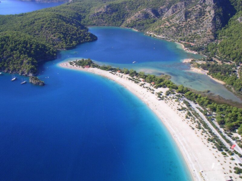 Aerial View of a Bay — Blue, Serene, Afternoon, Photograph, Beach, Mountains, Boats