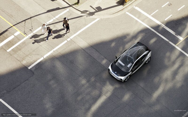 Aerial view of a car and pedestrians