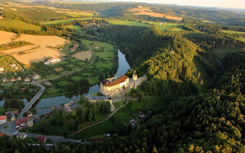 Aerial view of a castle by a river