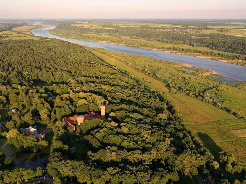 Aerial view of a castle by a river