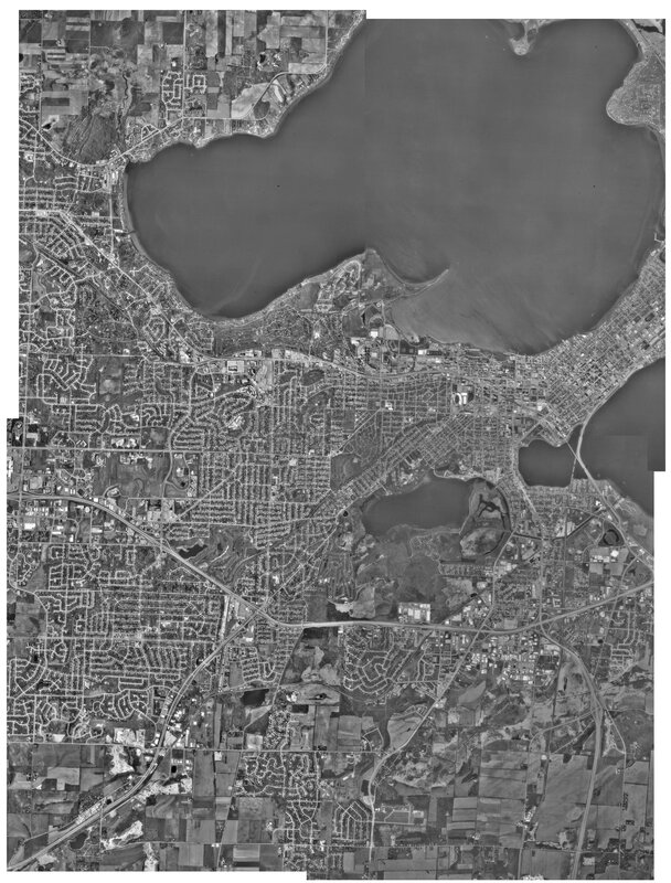 aerial view of a city by the lake