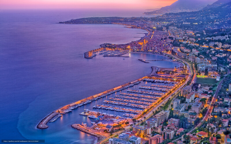 Aerial view of a coastal city at dusk