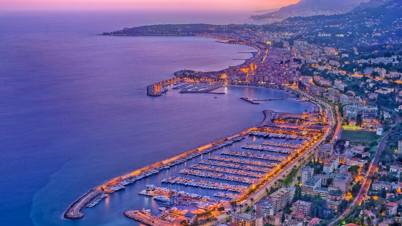 Aerial View of a Coastal City — Purple