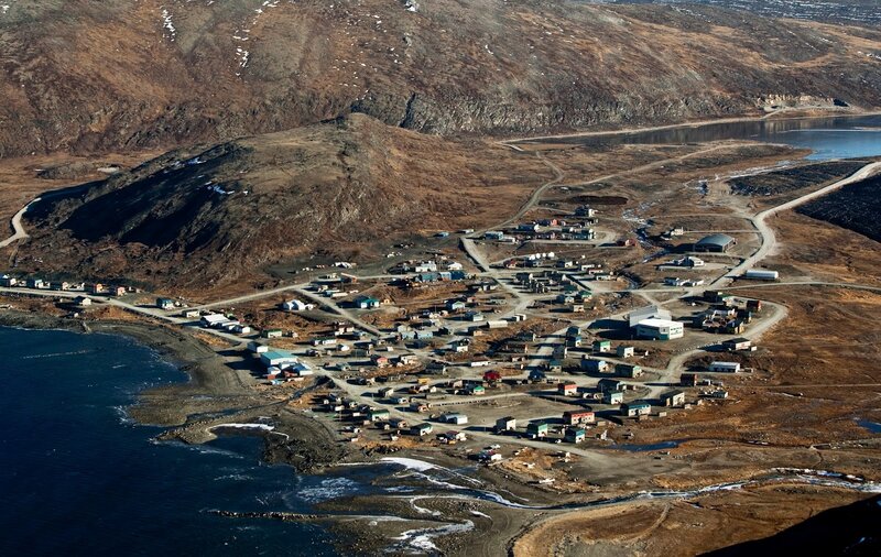 Aerial View of a Coastal Village — Brown