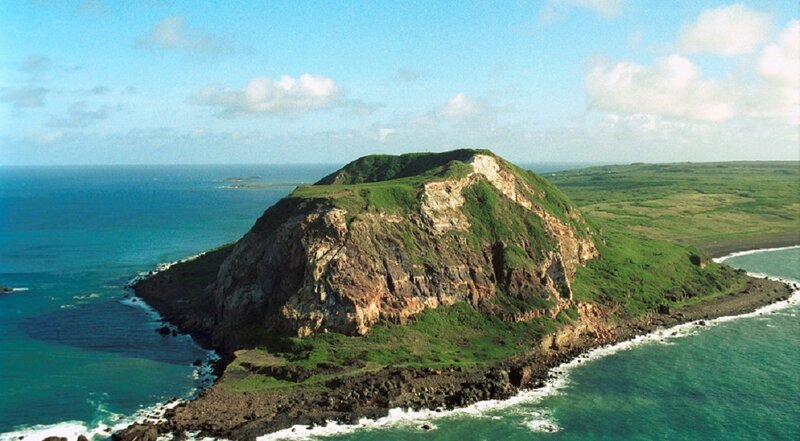 Aerial view of a coastal volcanic island