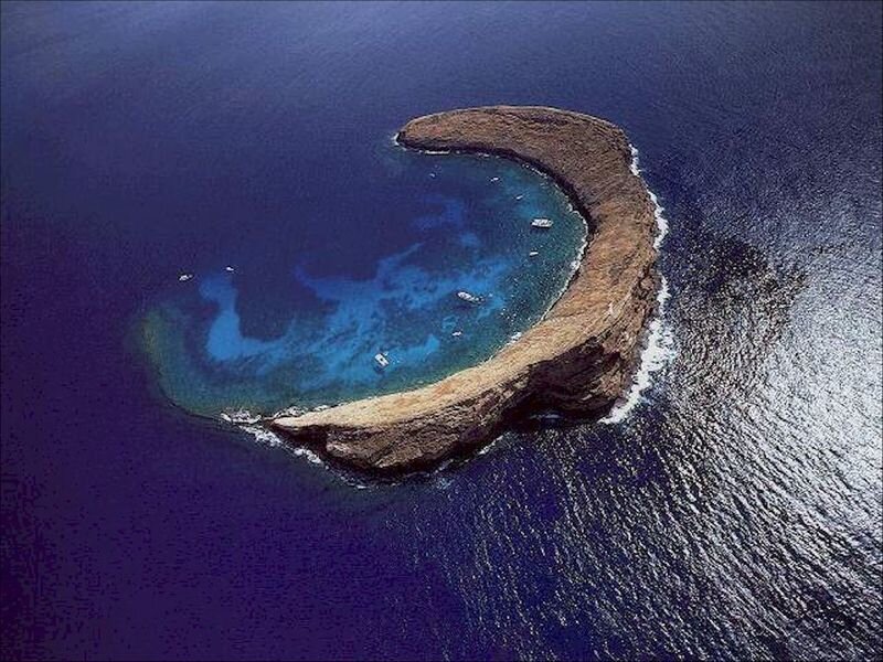 Aerial view of a crescent-shaped island