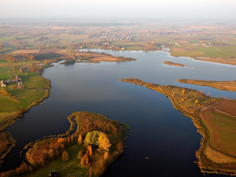 Aerial view of a lake and farmland