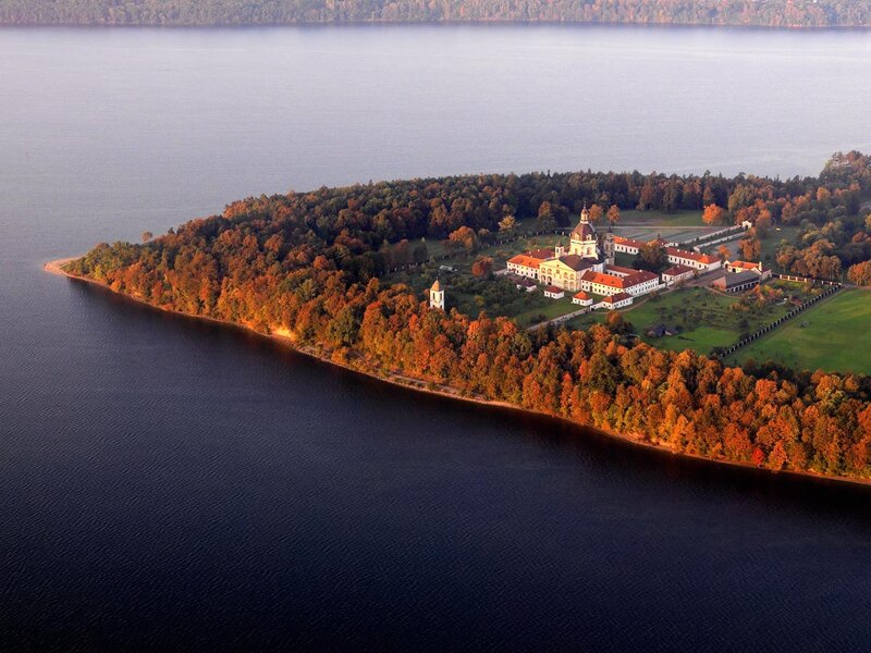 Aerial view of a lakeside monastery