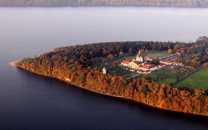 Aerial view of a lakeside monastery