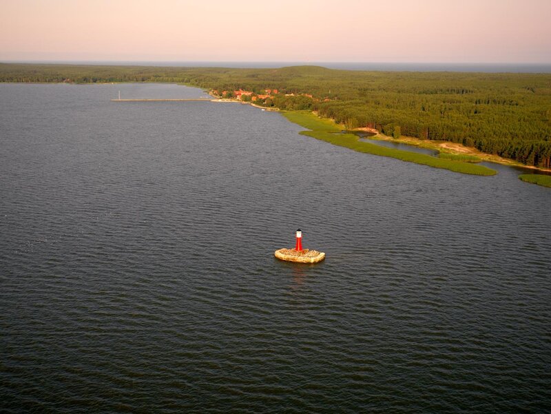 Aerial view of a lighthouse on a lake