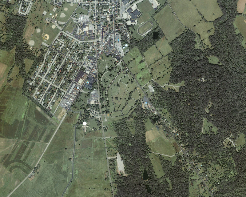 Aerial view of a town and surrounding fields