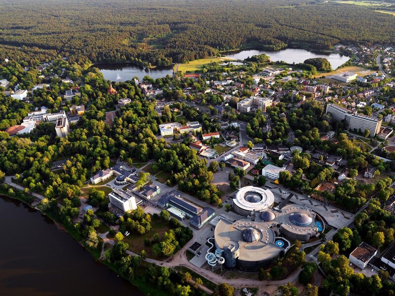 Aerial view of a town with lakes and forest