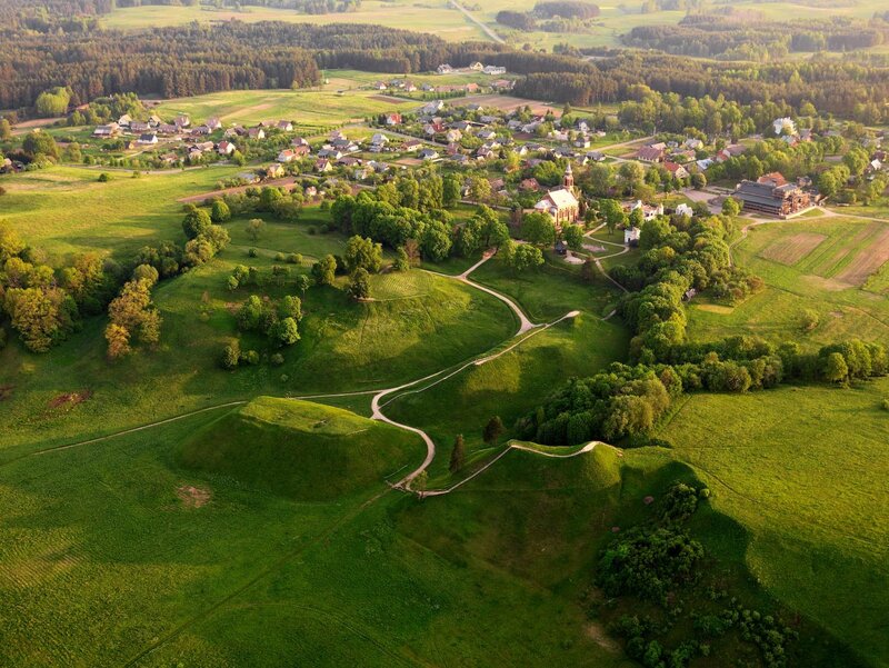 Aerial view of a village and hills