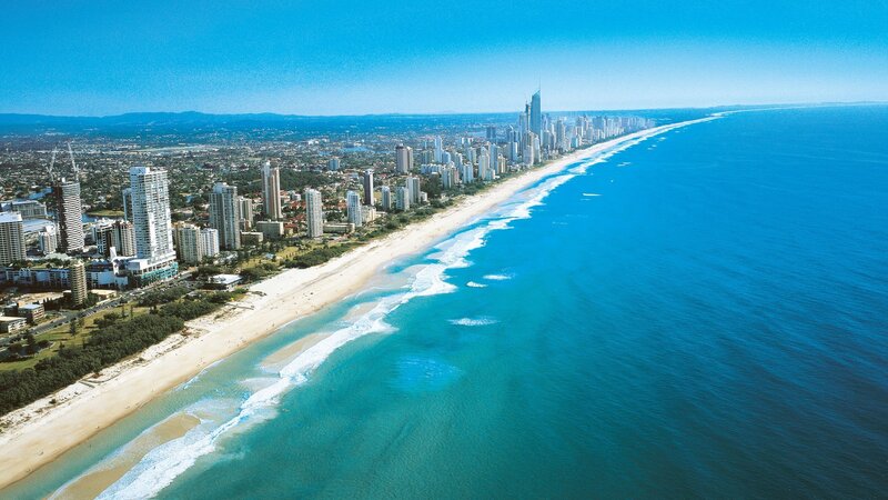 Aerial View of Beach City — Blue, Serene, Afternoon, Photograph, Skyscrapers, Ocean, Sand, White