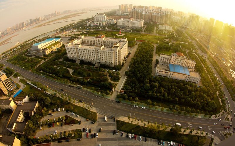 Aerial View of City Buildings — Green, Serene