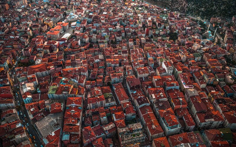 Aerial View of City Rooftops — Red