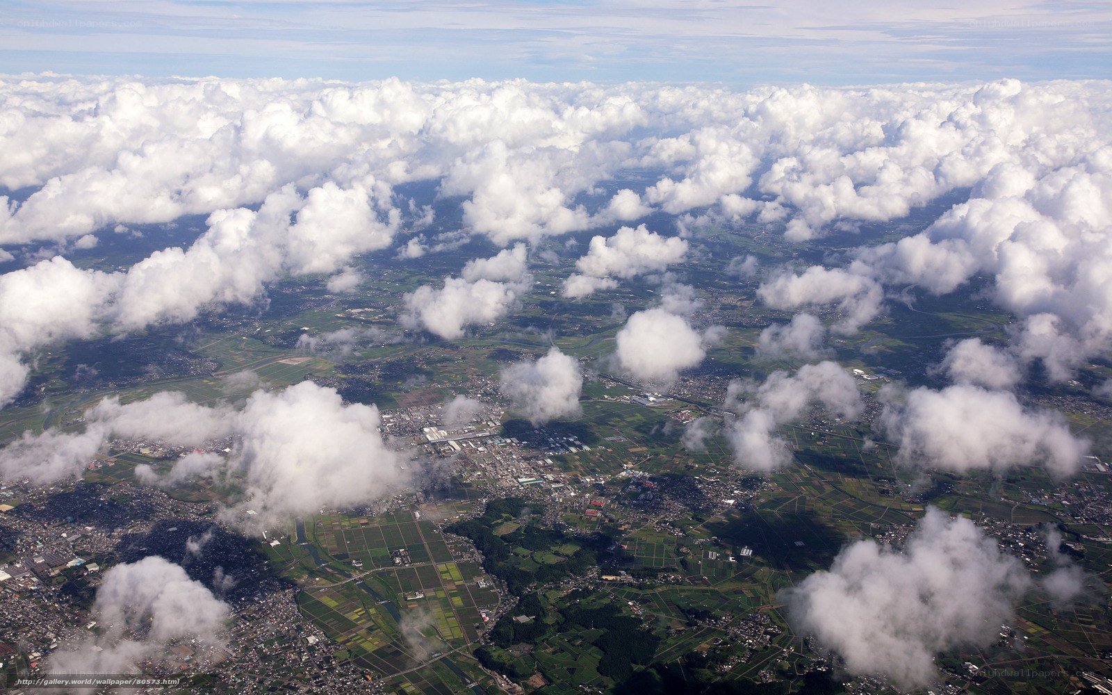 Aerial view of clouds and landscape
