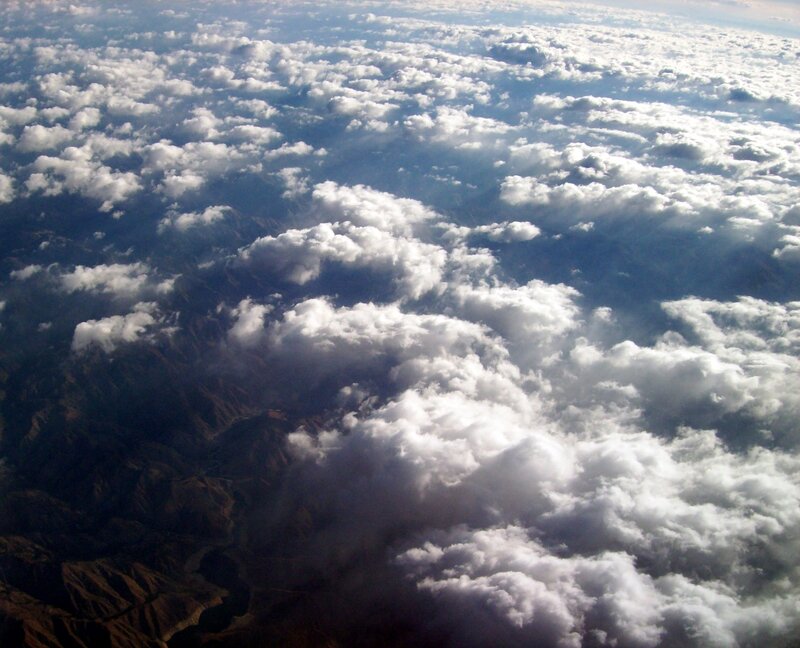 Aerial View of Clouds and Mountains — White