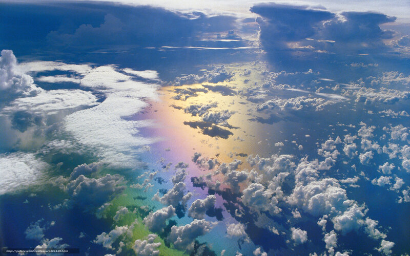 Aerial view of clouds and rainbow