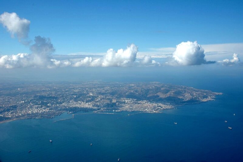 Aerial View of Coastal City — Blue, Serene, Afternoon, Photograph, Sea, Clouds