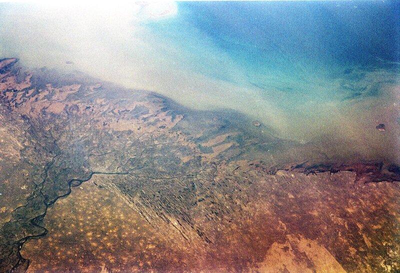 Aerial view of coastal land and water