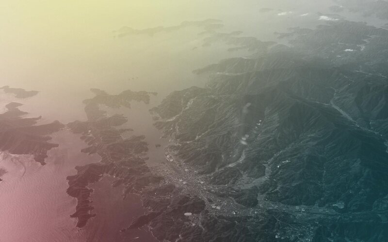 Aerial View of Coastal Mountains — Green, Serene, Sunset