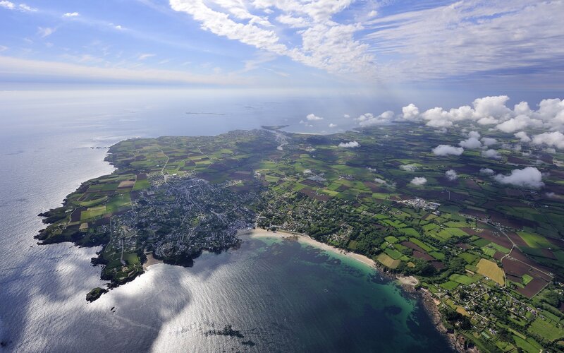 Aerial View of Coastal Town — Green, Serene, Afternoon, Photograph, Ocean, Fields, Clouds, Blue
