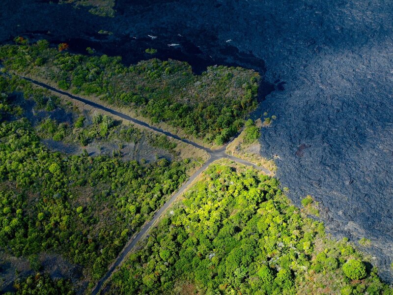 Aerial view of lava flow and forest