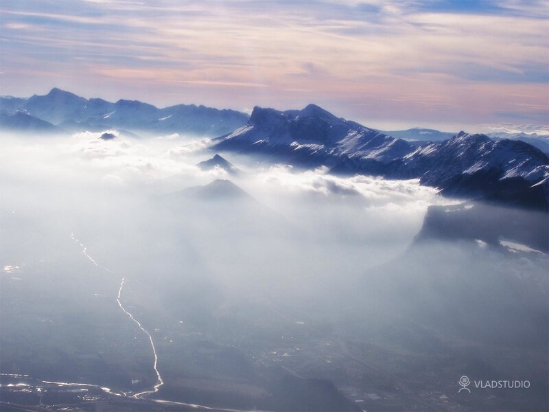 Aerial view of mountains above clouds
