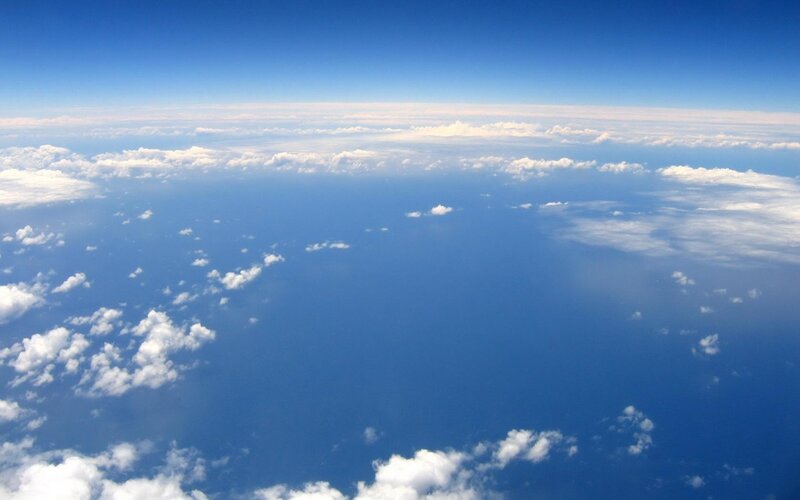 Aerial View of Ocean and Clouds — Blue, Serene, Afternoon, Photograph, Sky