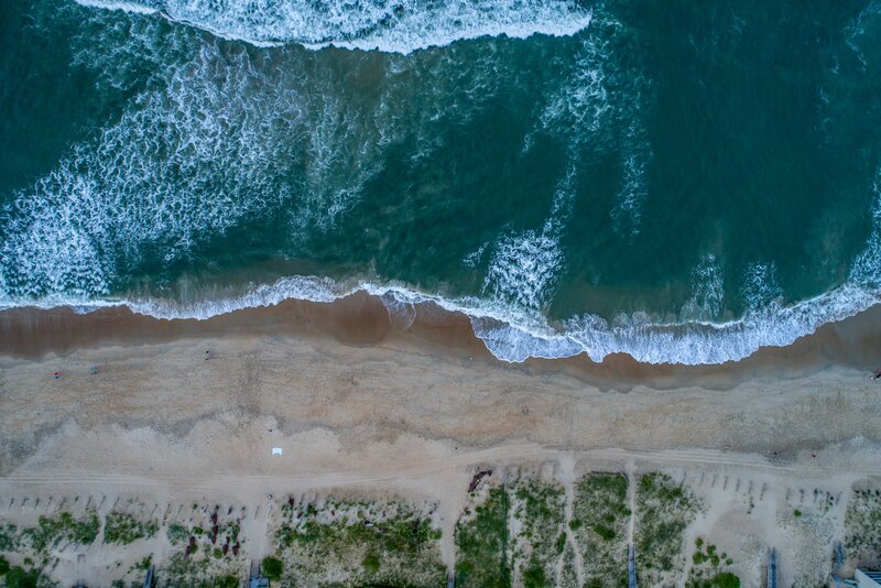 Aerial View of Ocean Waves — Blue, Serene, Sunset, Photograph
