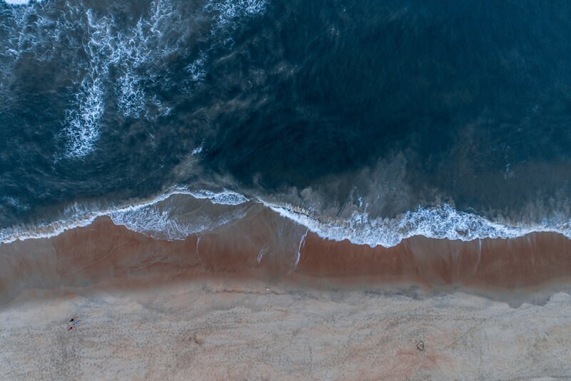 Aerial View of Ocean Waves — Blue, Serene, Sunset