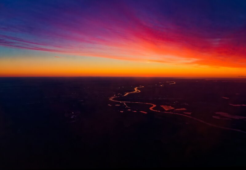 Aerial view of river at sunset