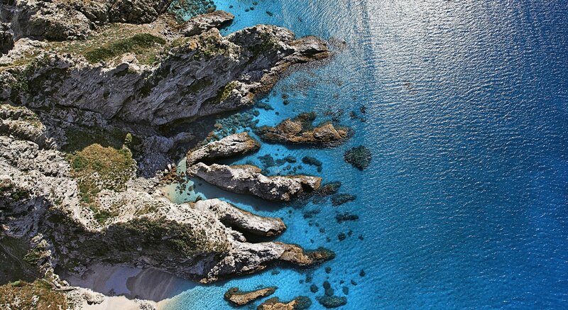 Aerial View of Rocky Coastline — Blue, Serene