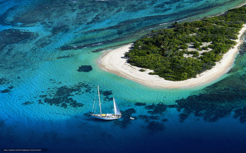 Aerial view of sailboat near island
