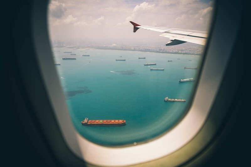 Aerial view of ships from airplane window