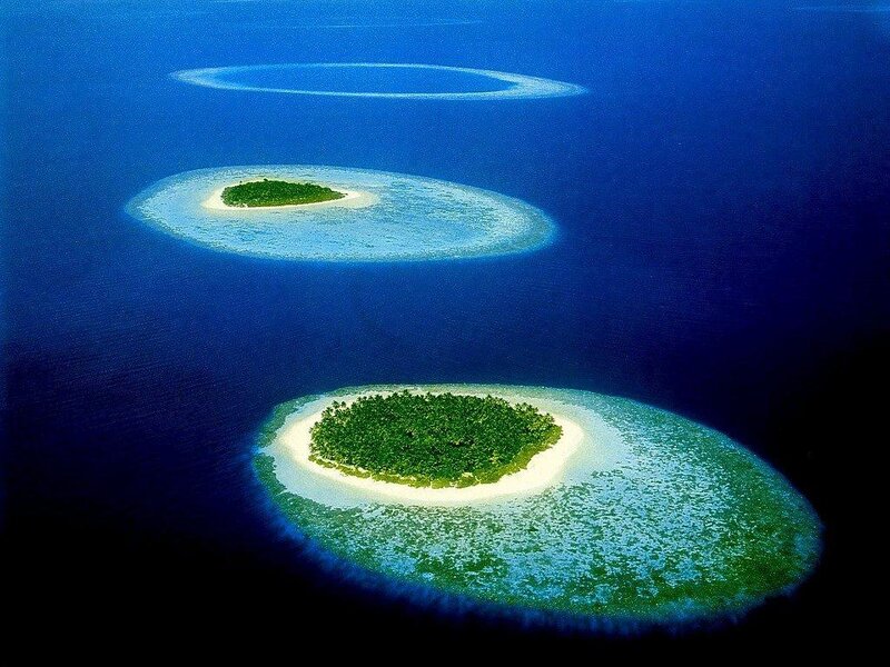 Aerial view of three atolls