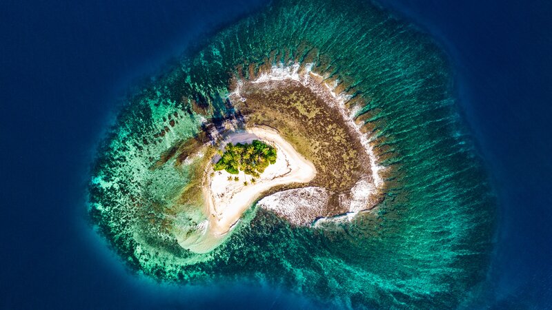 Aerial View of Tropical Island — Blue, Serene, Afternoon, Photograph, Coral Reef, Palm Trees, Sandbar