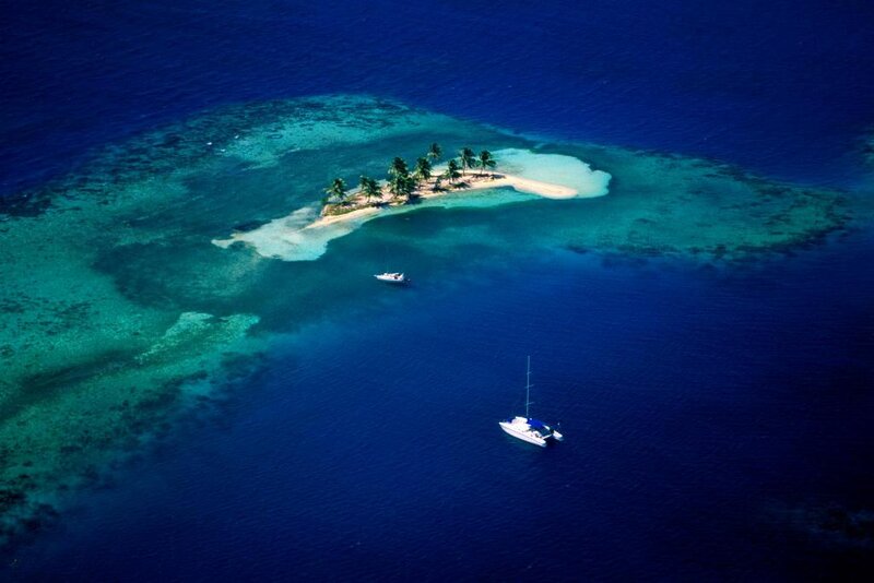 Aerial View of Tropical Island — Blue, Serene, Afternoon, Photograph, Sailboat