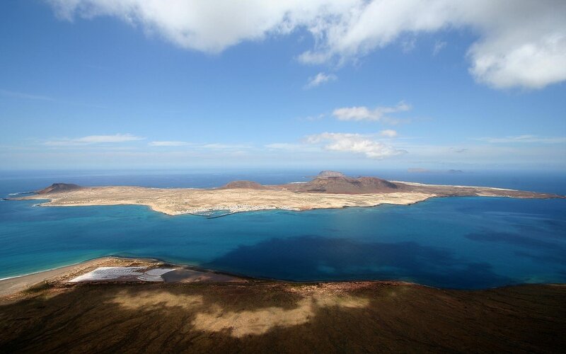 Aerial View of Volcanic Island — Blue, Serene, Afternoon