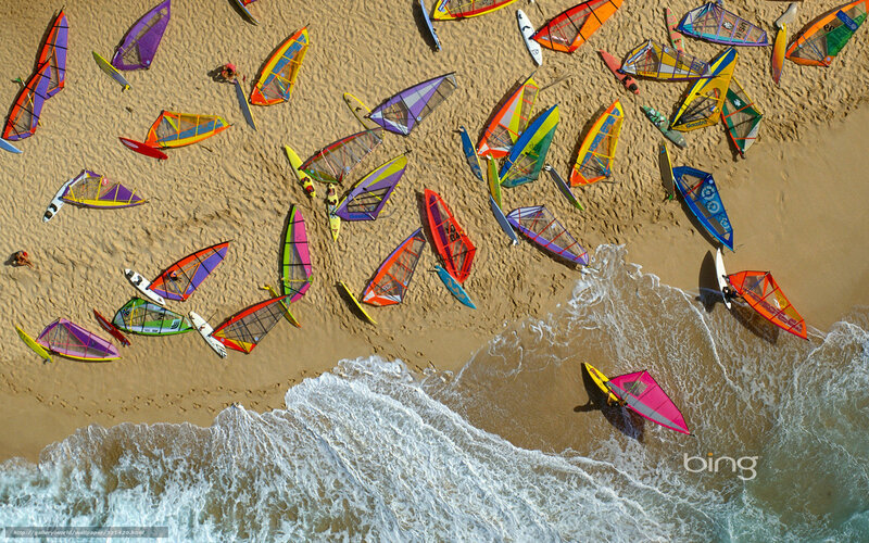 Aerial view of windsurfers on beach