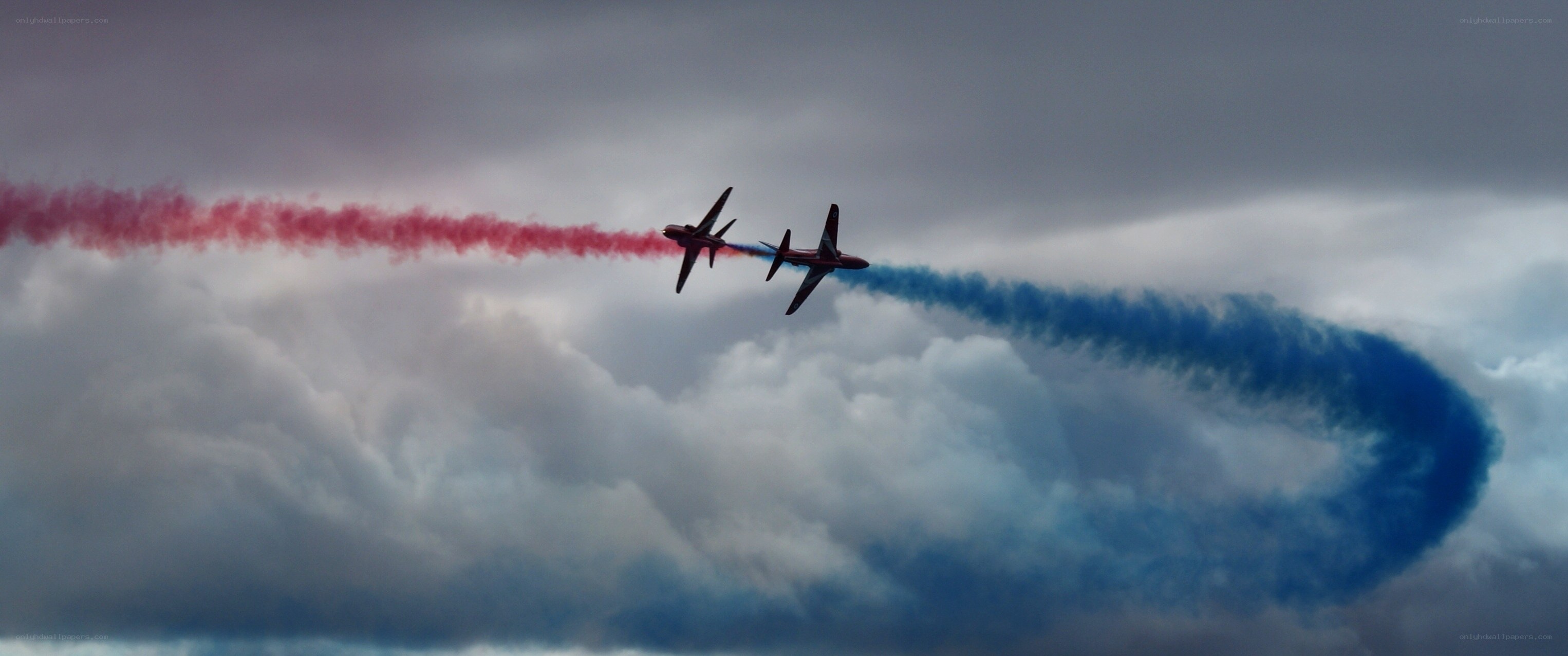Aerobatic jets with colored smoke
