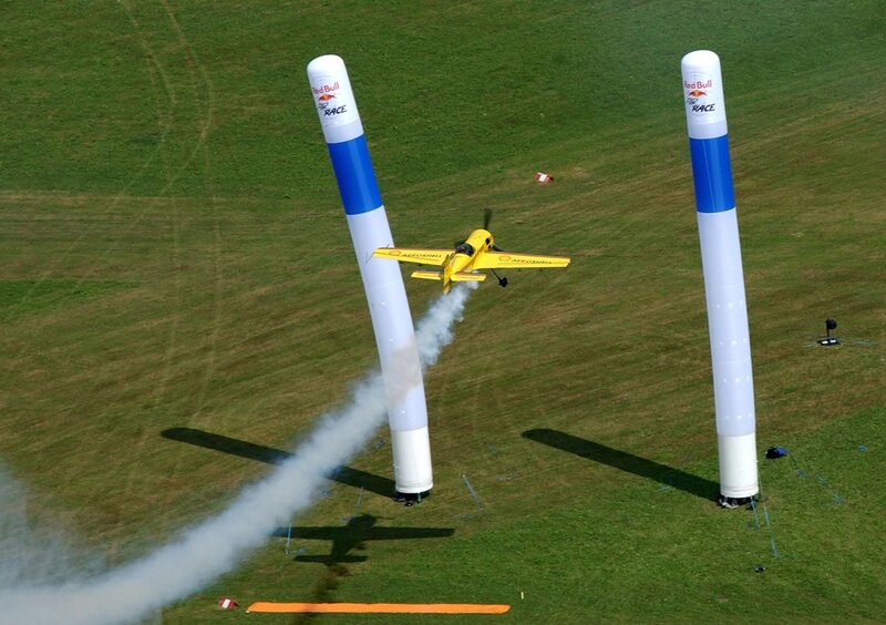 Aerobatic plane flying between pylons