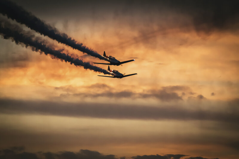 Aerobatic planes at sunset